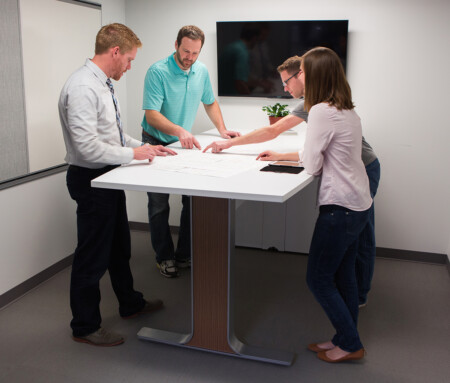Innovative Office Solutions team members working together around a table