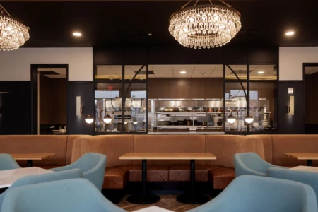 Chic dining area with plush seating and elegant lighting.